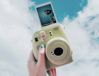 Girls hand with a camera