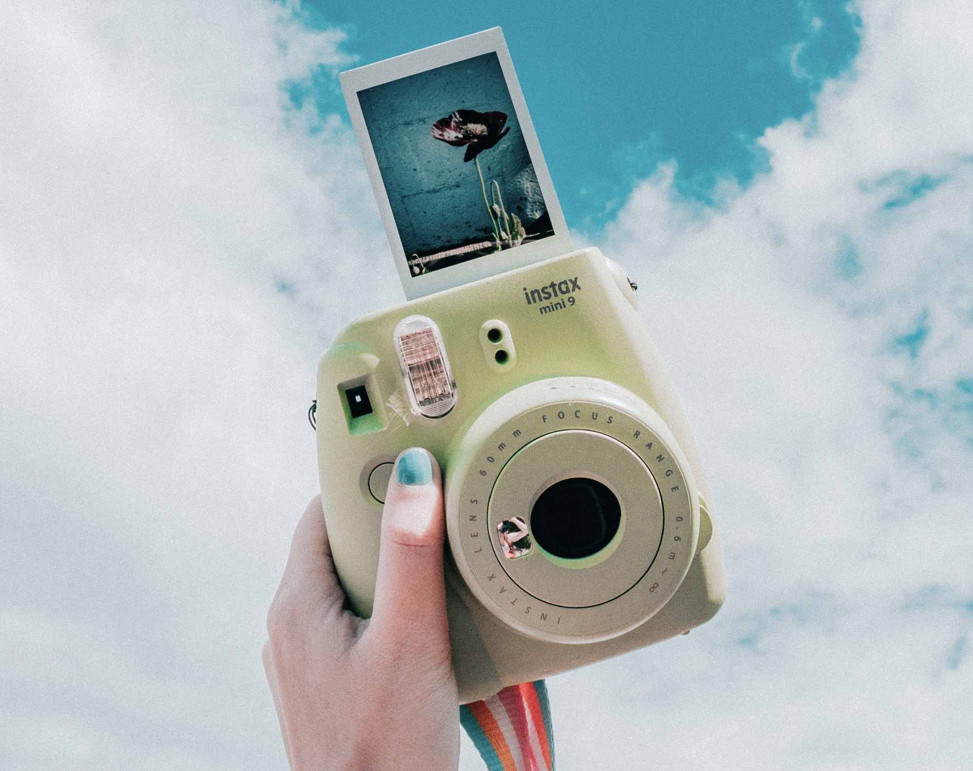 Girls hand with a camera