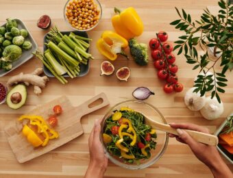 table full of vegetables making a salad