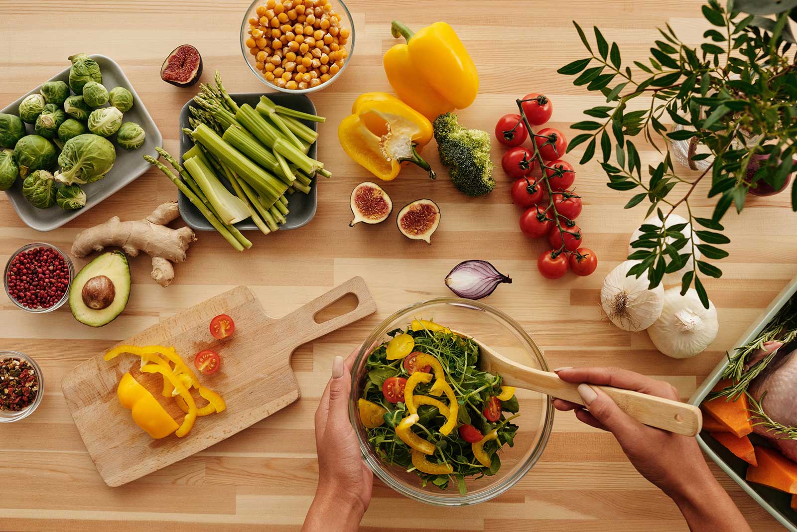 table full of vegetables making a salad